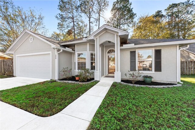 ranch-style home with a garage and a front yard