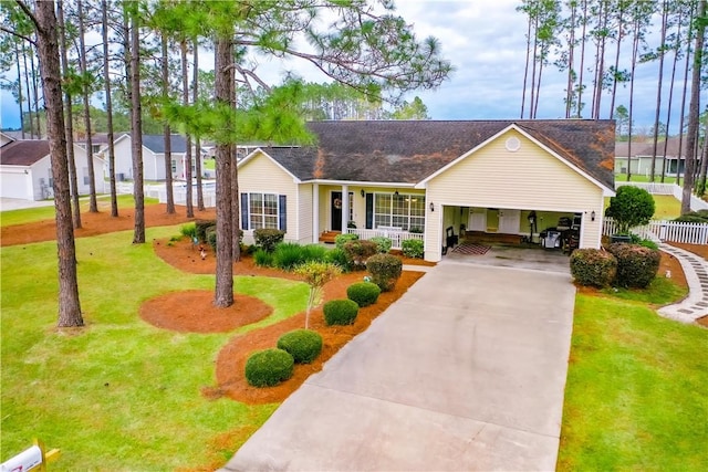 ranch-style home featuring a front yard, a porch, and a carport