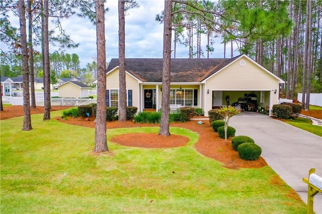 ranch-style home with a garage and a front yard