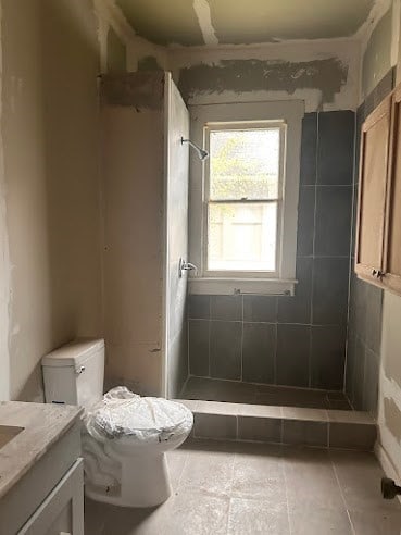 505 N Nicholls St, Waycross, GA 31501 - bathroom with vanity, a shower stall, and tile patterned flooring
