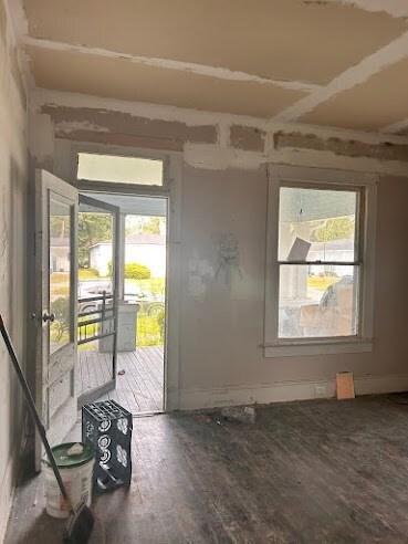 doorway to outside with wood-type flooring and a healthy amount of sunlight