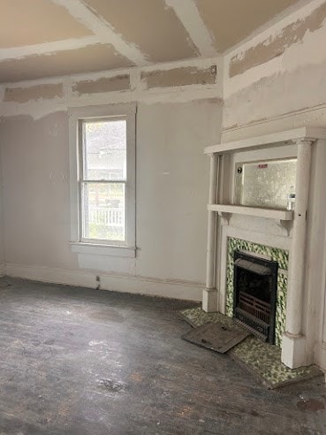 505 N Nicholls St, Waycross, GA 31501 - unfurnished living room featuring a fireplace and baseboards