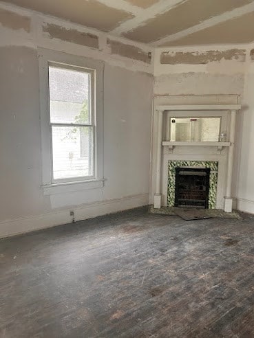 505 N Nicholls St, Waycross, GA 31501 - unfurnished living room with a fireplace and baseboards