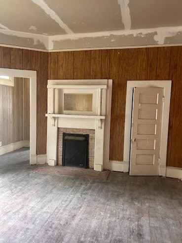 505 N Nicholls St, Waycross, GA 31501 - unfurnished living room featuring a fireplace and wood finished floors