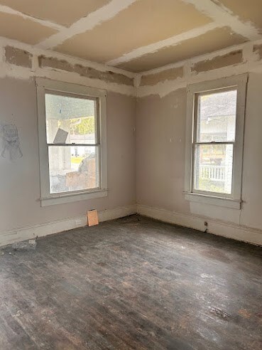 spare room featuring hardwood / wood-style flooring