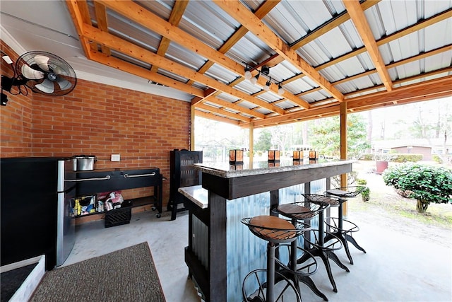 view of patio / terrace featuring an outdoor bar