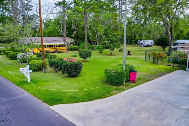 surrounding community featuring a yard