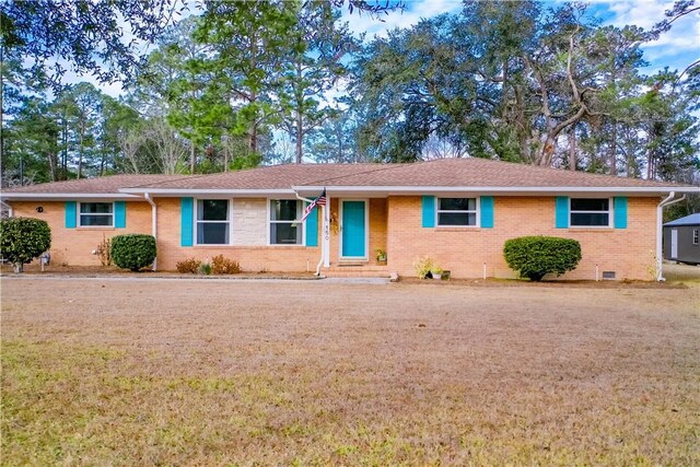 single story home with brick siding, a front lawn, and crawl space