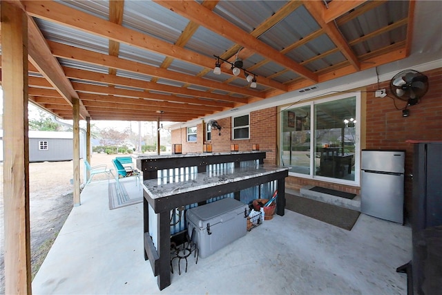 view of patio / terrace with visible vents and an outbuilding