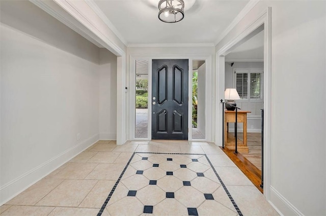 entrance foyer with light hardwood / wood-style floors and crown molding