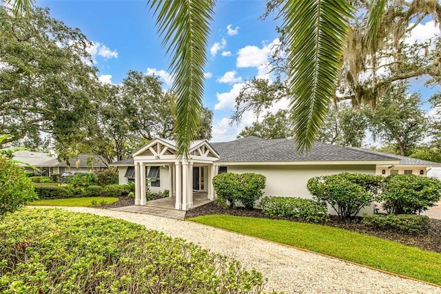 ranch-style house with a front yard