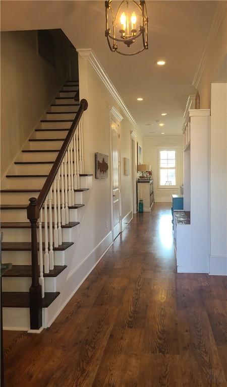2115 Marshview Dr, Shellman Bluff, GA 31331 - stairs featuring a chandelier, wood finished floors, crown molding, and recessed lighting