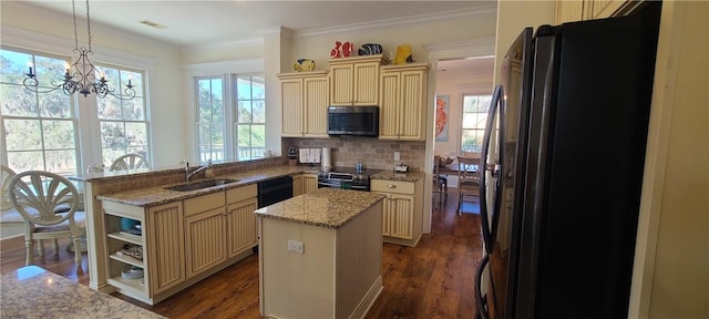 2115 Marshview Dr, Shellman Bluff, GA 31331 - kitchen featuring cream cabinets, freestanding refrigerator, range with electric stovetop, a peninsula, and a chandelier
