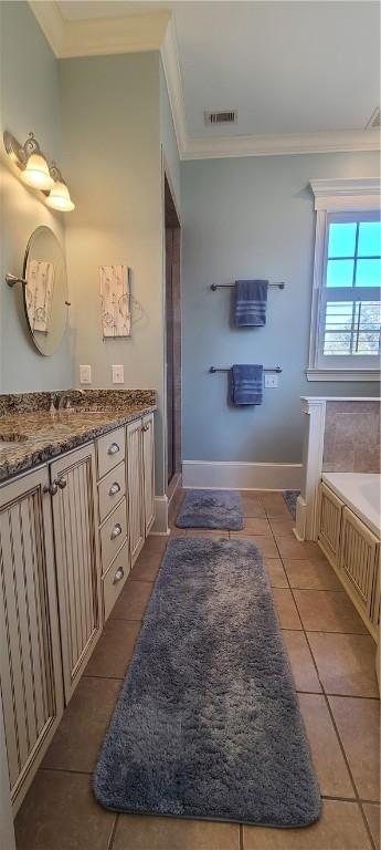 2115 Marshview Dr, Shellman Bluff, GA 31331 - full bath with ornamental molding, tile patterned floors, vanity, and a garden tub