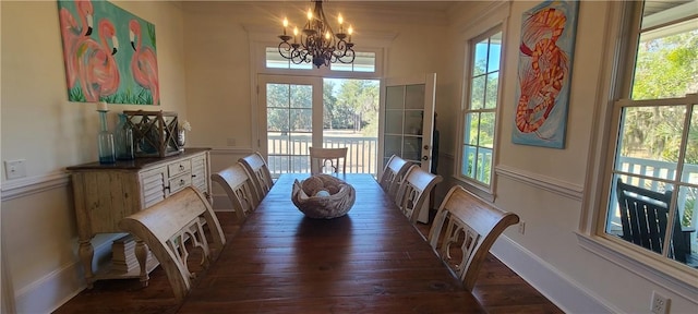 2115 Marshview Dr, Shellman Bluff, GA 31331 - dining room featuring a chandelier, healthy amount of natural light, and wood-type flooring