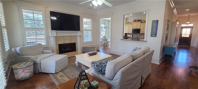 2115 Marshview Dr, Shellman Bluff, GA 31331 - living room featuring crown molding, a tile fireplace, wood finished floors, a ceiling fan, and recessed lighting