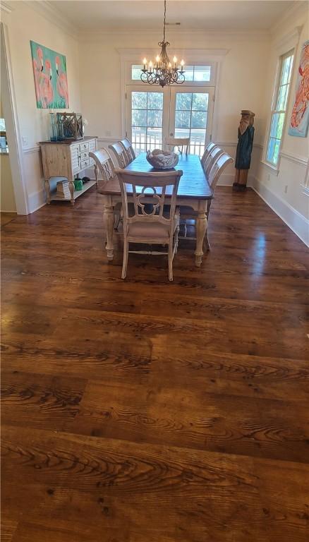 2115 Marshview Dr, Shellman Bluff, GA 31331 - dining area with a chandelier, dark wood-style floors, and ornamental molding