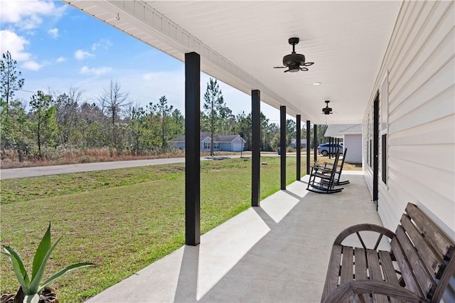 825 Red Hawk Dr, Waynesville, GA 31566 - covered porch featuring a yard and a ceiling fan