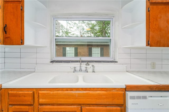 101 Forrest Ave, Waycross, GA 31501 - kitchen featuring open shelves, light countertops, dishwasher, and tasteful backsplash