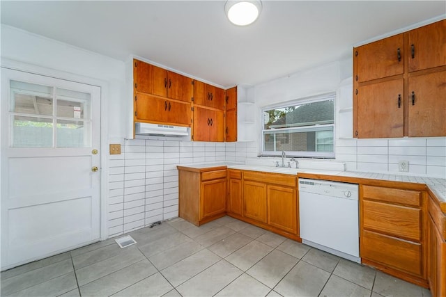 101 Forrest Ave, Waycross, GA 31501 - kitchen with white dishwasher, open shelves, under cabinet range hood, and light tile patterned flooring