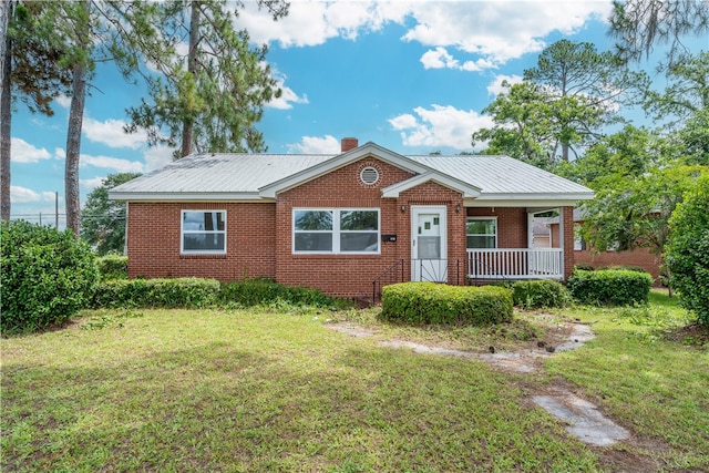 101 Forrest Ave, Waycross, GA 31501 - bungalow-style house featuring a front yard, covered porch, and a metal roof