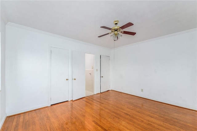 101 Forrest Ave, Waycross, GA 31501 - unfurnished bedroom with wood finished floors, crown molding, and ceiling fan