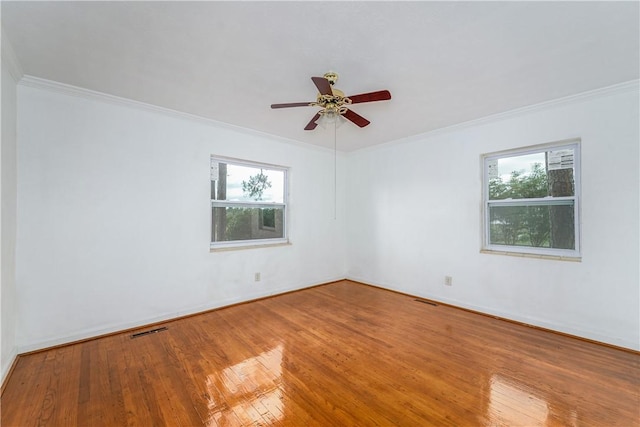 101 Forrest Ave, Waycross, GA 31501 - unfurnished room with wood finished floors, ornamental molding, and ceiling fan