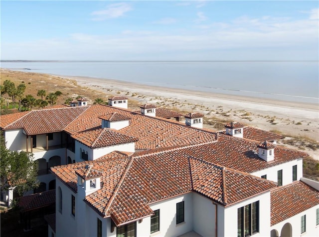 aerial view featuring a view of the beach and a water view