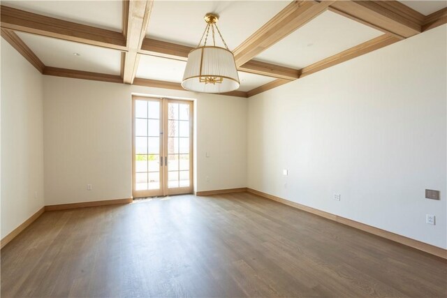 spare room featuring hardwood / wood-style flooring, crown molding, beam ceiling, coffered ceiling, and french doors