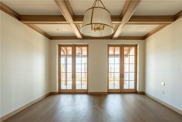 doorway featuring french doors, wood-type flooring, coffered ceiling, and beam ceiling