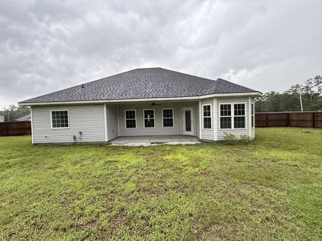 70 Harmonees Way, Ludowici, GA 31316 - rear view of property featuring a patio area, a fenced backyard, and a shingled roof