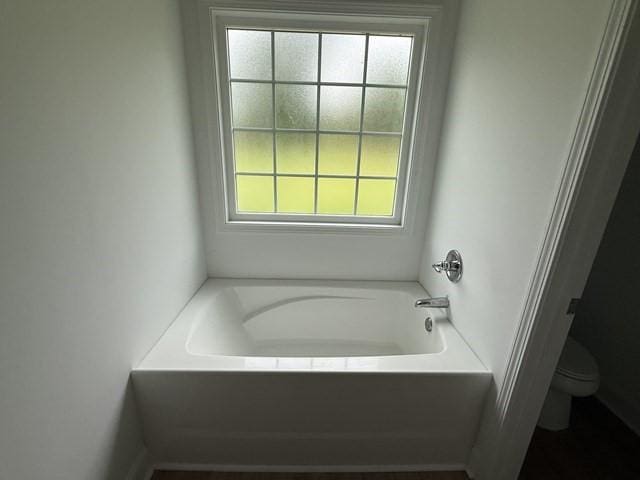 70 Harmonees Way, Ludowici, GA 31316 - full bath with healthy amount of natural light and a garden tub