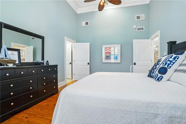 164 Sunrise Dr, Saint Simons Island, GA 31522 - bedroom featuring crown molding, visible vents, and a towering ceiling