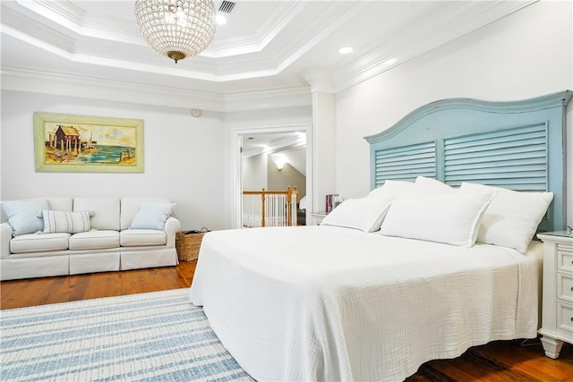 164 Sunrise Dr, Saint Simons Island, GA 31522 - bedroom with an inviting chandelier, ornamental molding, wood finished floors, and recessed lighting