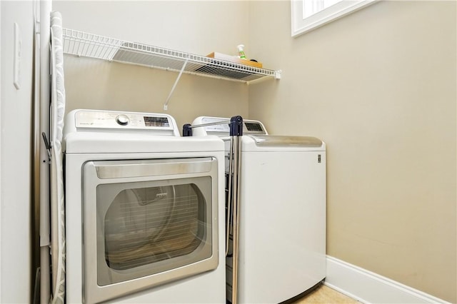 164 Sunrise Dr, Saint Simons Island, GA 31522 - clothes washing area with independent washer and dryer and laundry area