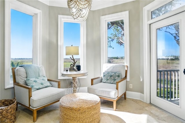 164 Sunrise Dr, Saint Simons Island, GA 31522 - sunroom / solarium featuring a chandelier
