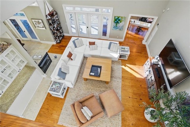 164 Sunrise Dr, Saint Simons Island, GA 31522 - living area with baseboards, french doors, and wood finished floors