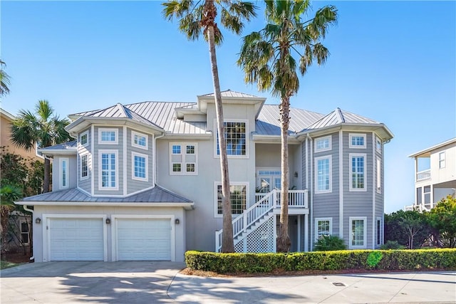 164 Sunrise Dr, Saint Simons Island, GA 31522 - townhome / multi-family property with an attached garage, a standing seam roof, concrete driveway, and metal roof