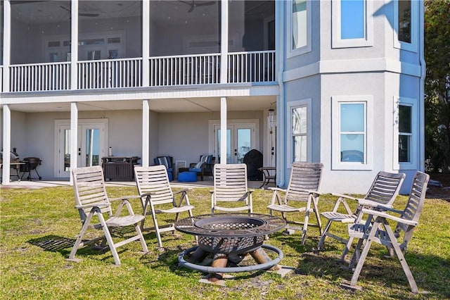 164 Sunrise Dr, Saint Simons Island, GA 31522 - rear view of house with stucco siding, a patio area, and french doors