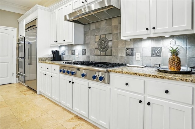 164 Sunrise Dr, Saint Simons Island, GA 31522 - kitchen featuring under cabinet range hood, stainless steel appliances, backsplash, light stone countertops, and white cabinetry
