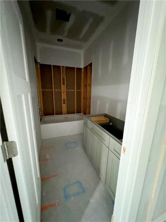 bathroom featuring concrete floors