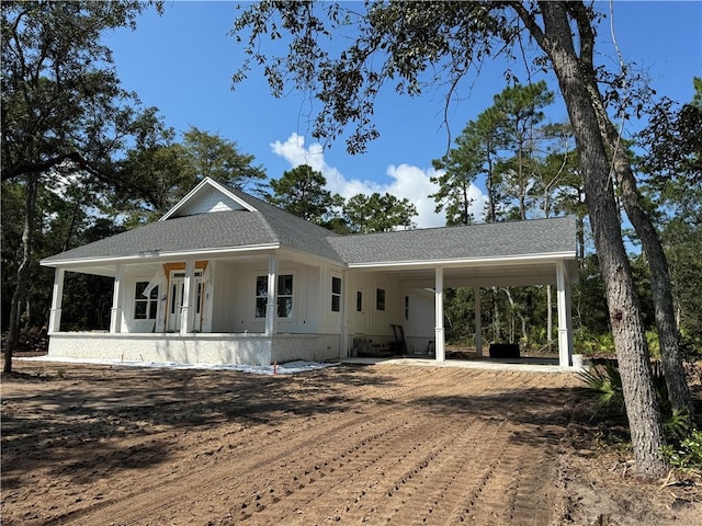 view of front of home with a carport