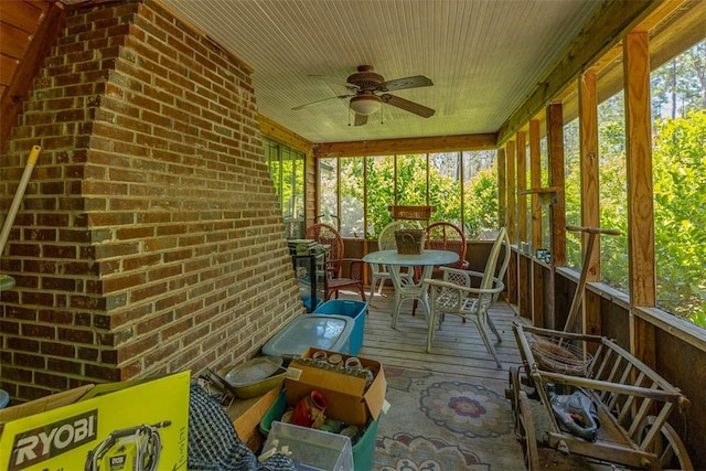 sunroom with a wealth of natural light and ceiling fan