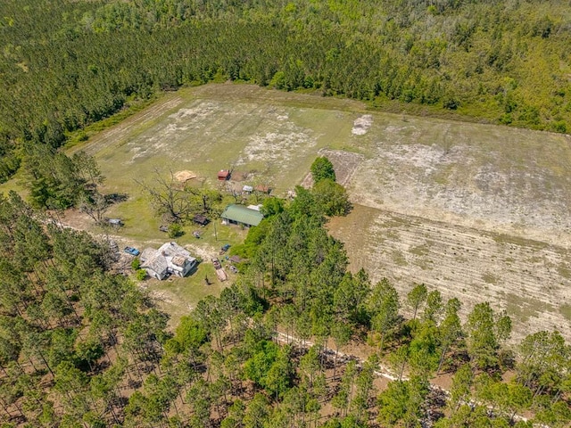 birds eye view of property with a rural view and a view of trees