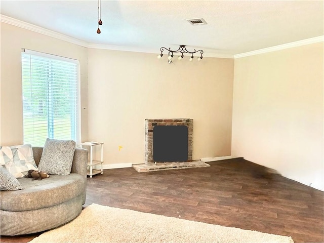 1002 Cherokee Cir, Waycross, GA 31501 - living room with wood finished floors, ornamental molding, baseboards, and a brick fireplace