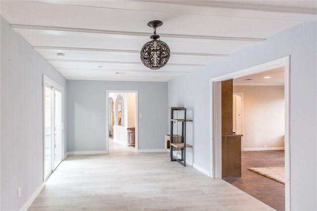 1002 Cherokee Cir, Waycross, GA 31501 - hallway with beam ceiling, light wood finished floors, baseboards, and arched walkways