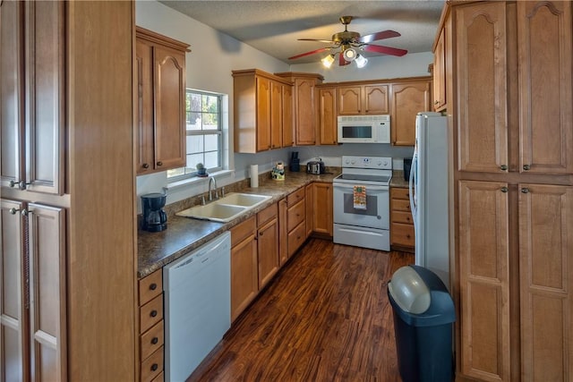 kitchen with ceiling fan, sink, dark hardwood / wood-style floors, a textured ceiling, and white appliances