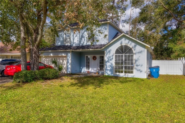 view of front of property featuring a front yard and a garage