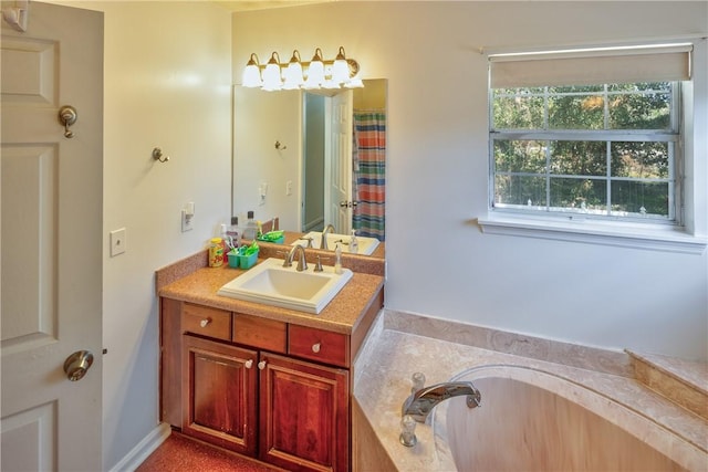 bathroom featuring vanity and a washtub