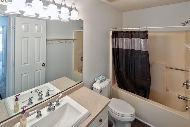 full bathroom with shower / tub combo with curtain, vanity, and toilet